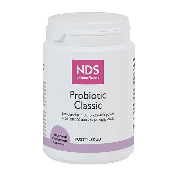 White jar labeled NDS Probiotic Classic, a multi-probiotic powder container with purple accent.
