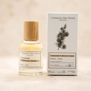 Perfume bottle with a wooden cap beside its box, both labeled 'L'Essence Des Notes, Provence: Coriandre & Bois de Cèdre' (Eau de Parfum).