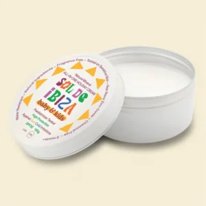 Open white jar of moisturizing cream for babies and kids with a colorful circular label on the lid.
